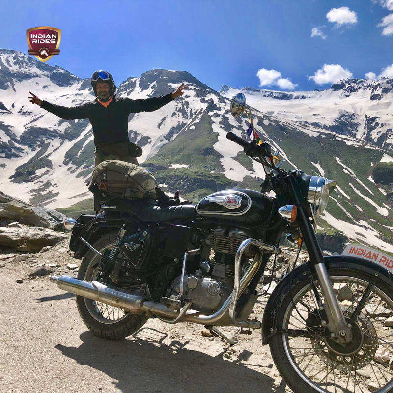 A biker enjoying the views on the road trip to the Indian Himalayas on a Motorcycle I Ladakh motorcycle tour package, 2023