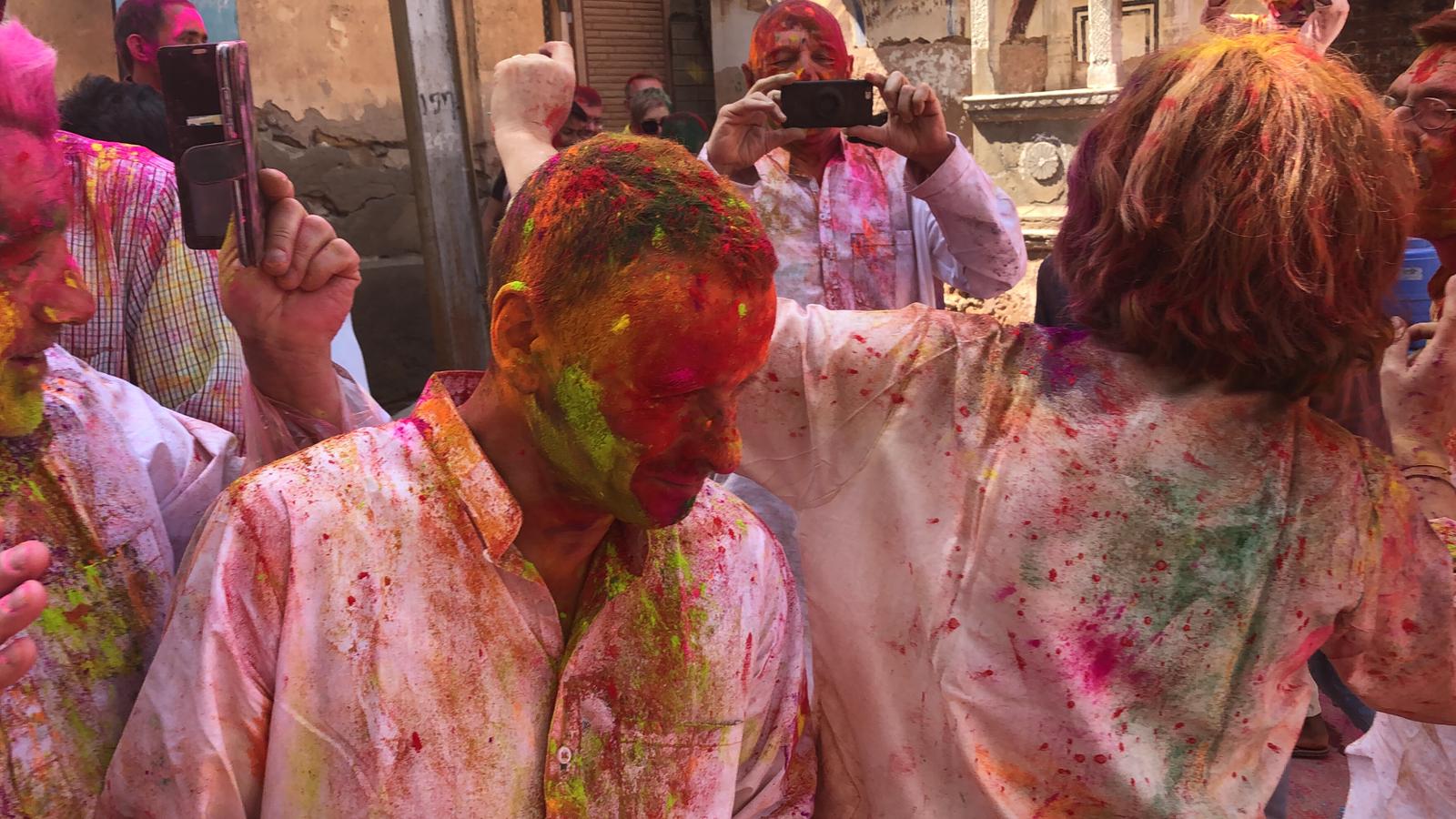 Foreign tourists splattered in vibrant colors of Holi in India I Enjoy Indian holi Festival with colors in India I Holi Trip
