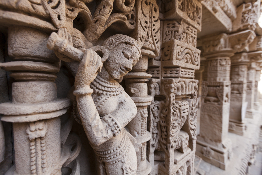 Carved idols on the walls of Rani ki Vav, step well in Patan, Gujarat I Historical & Cultural Motorcycle Tour to India, 2023