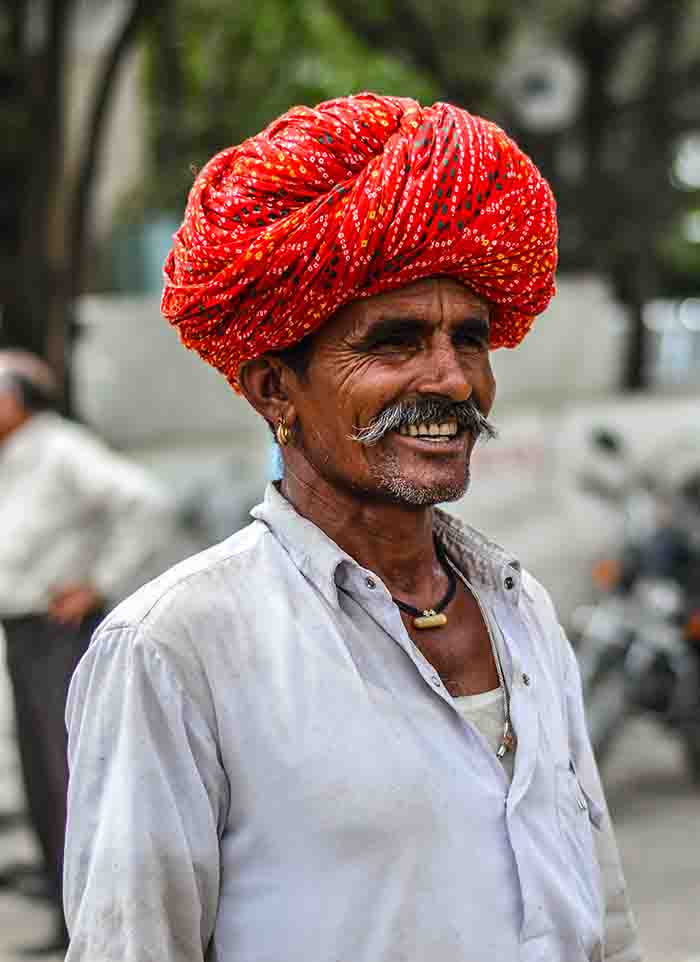 An old Rajasthani man with a big mustache & wearing a colorful turban I A motorcycle adventure tour to Central India, 2023