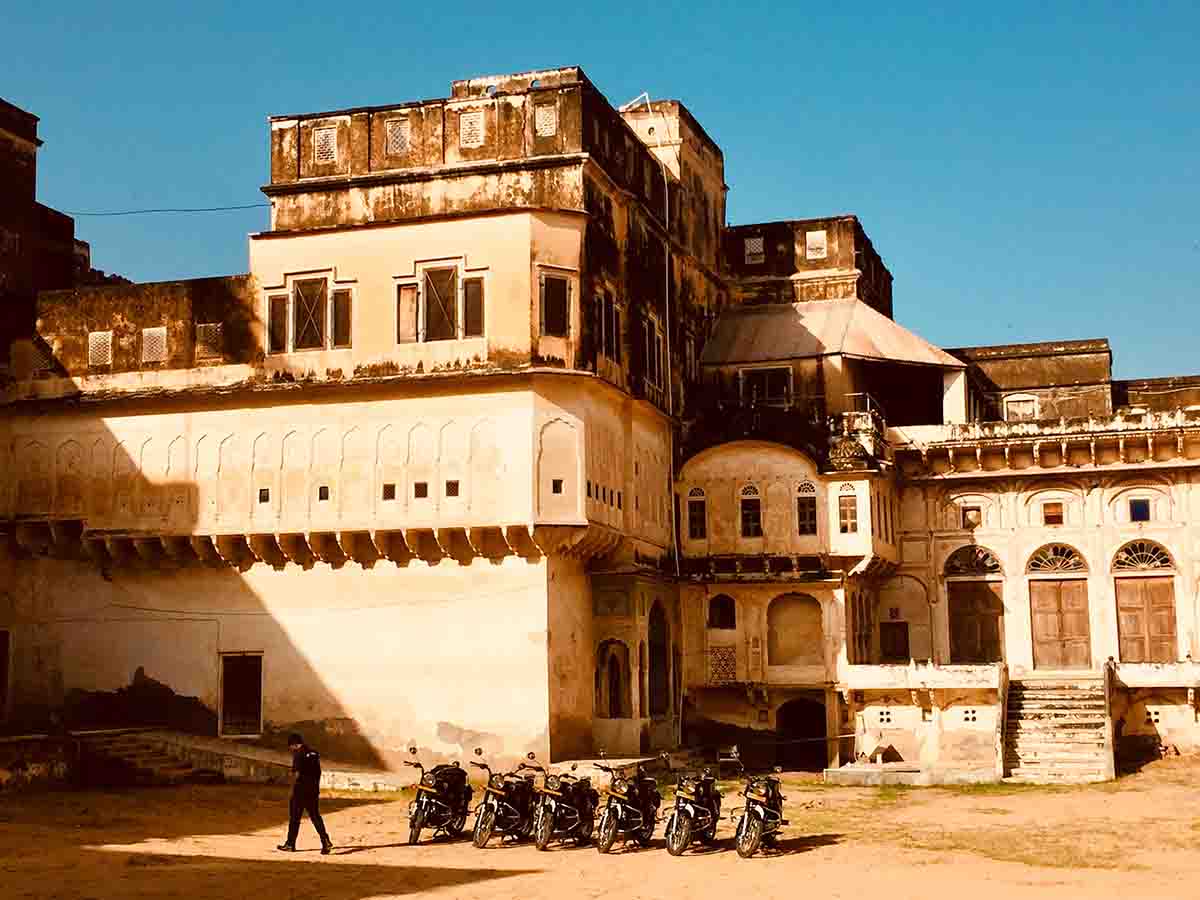 The Mandawa Fort of Rajasthan I A fleet of Indan Rides' Royal Enfileds parked against the Mandawa Fort I Heritage Tourism