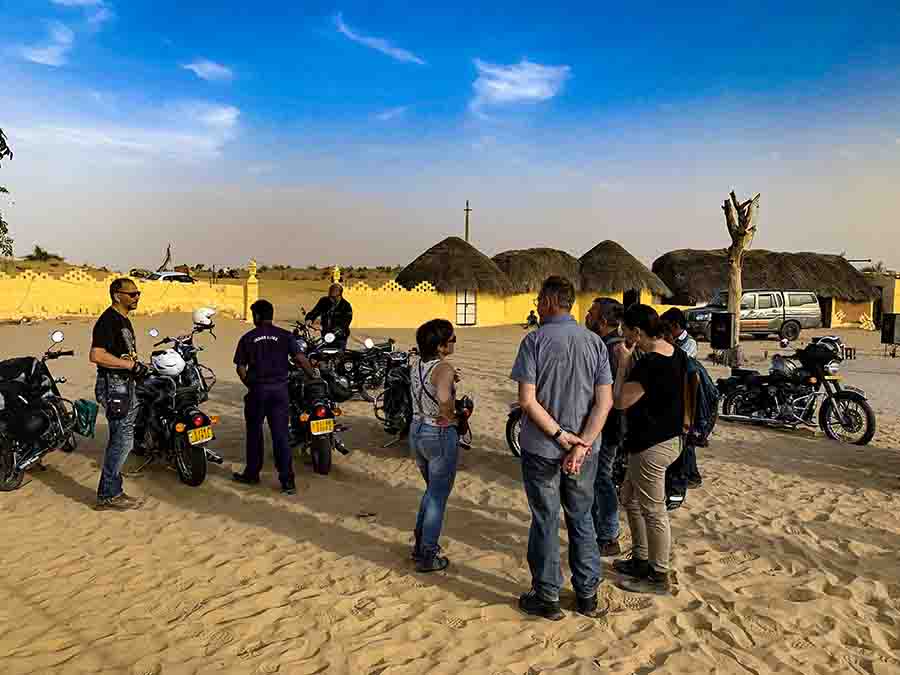 A group of Bike riders in the villages of Rajasthan I A view of village huts of India I Rustic Rajasthan on Royal Enfield